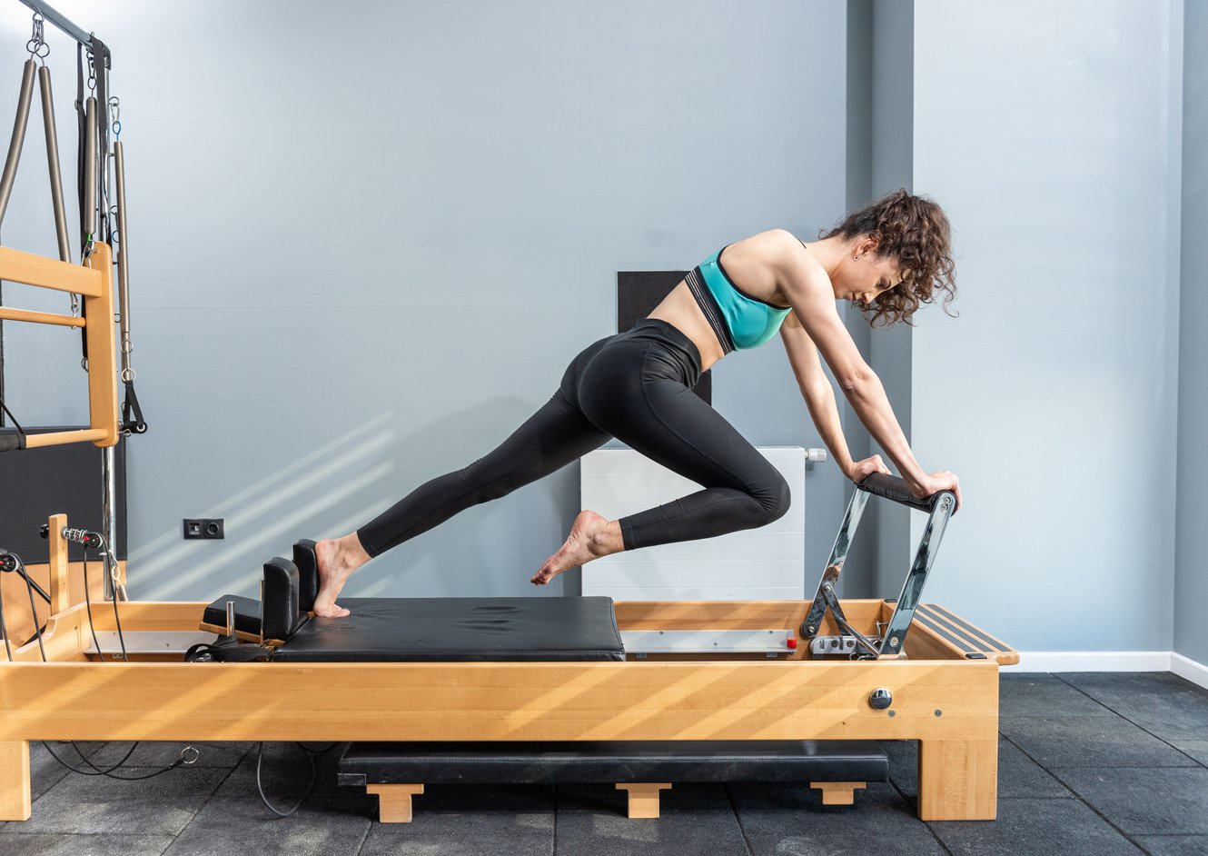 Pilates exercise on pilates machine